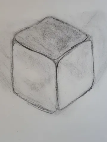 Een kubus in houtskool geschetst